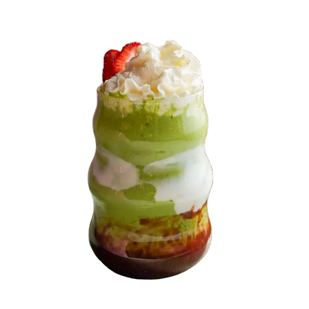 Strawberry Cheesecake Matcha with whipped cream and a strawberry